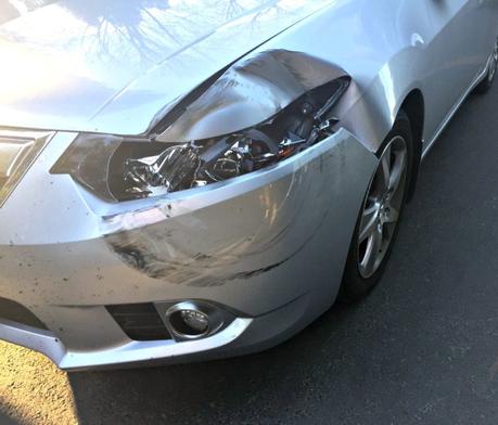 damage to car from flying wheel on freeway