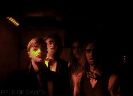 Field Of Giants Image may contain: 3 people, night and indoor