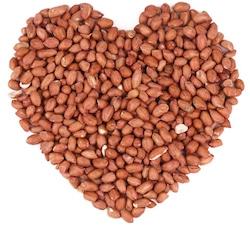 Is Peanut Butter Good or Bad for Your Health? Nutrition Facts deshelled peanuts shaped as heart