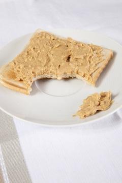 Is Peanut Butter Good or Bad for Your Health? Nutrition Facts peanut butter on sliced bread