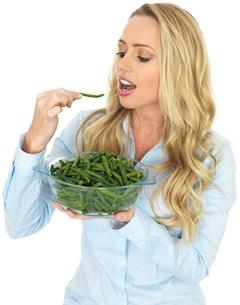 woman holding bowl of green beans