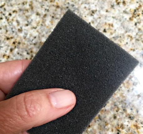 use a piece of foam to clean caked-on dirt from clothing