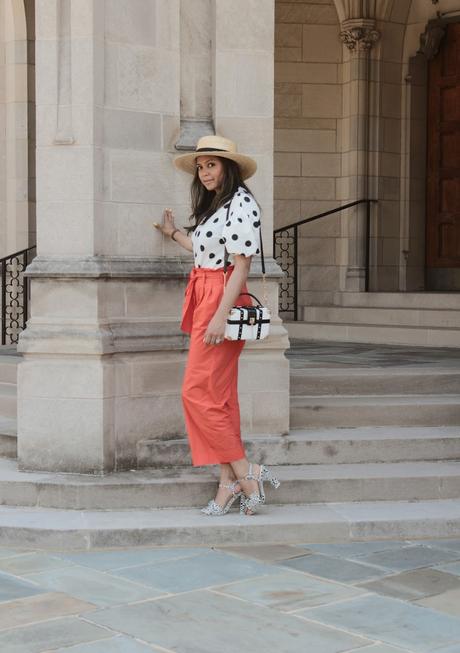 how to wear polka dots, zara puff sleeve blouse, orange paper bag waist pants outfit, printed sandals, white and black, orange trousers, high waisted, boxed bag, myriad musings 