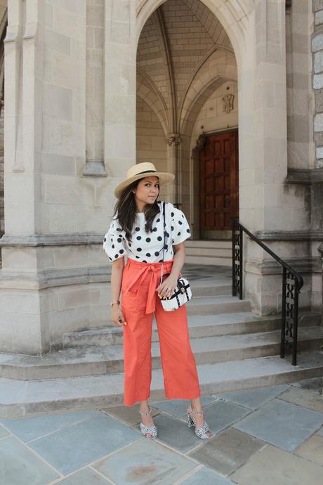 how to wear polka dots, zara puff sleeve blouse, orange paper bag waist pants outfit, printed sandals, white and black, orange trousers, high waisted, boxed bag, myriad musings 