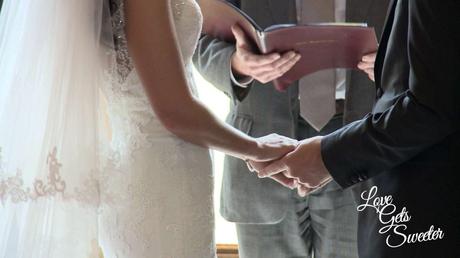An Elegant and Stylish Lakes Wedding Video bride and groom holding hands during their wedding ceremony at armathwaite hall caught on the wedding video