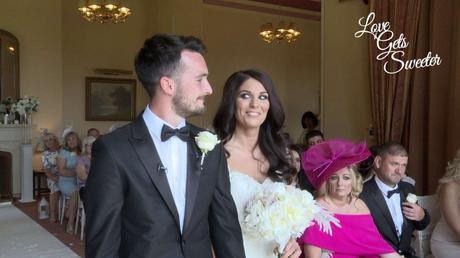 An Elegant and Stylish Lakes Wedding Video bride gives a happy, cheeky smile to her Groom during their wedding ceremony in the lake district