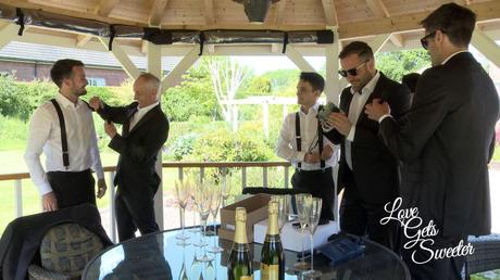 An Elegant and Stylish Lakes Wedding Video groom and ushers getting ready in the parents garden under the gazebo on a hot summers day in Penrith
