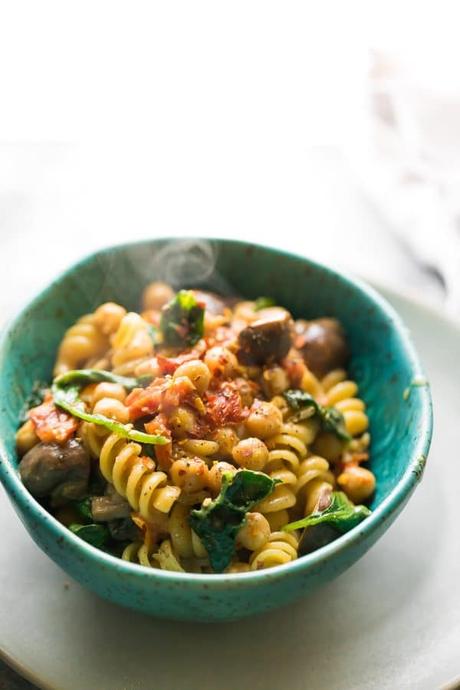 Sun dried tomato chickpea one pot pasta with mushrooms and spinach, which can be assembled up to 3 days ahead for a super easy meal prep dinner recipe!