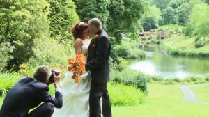 claire and justin posing for their wedding photographer and videographer at consall hall gardens in staffordshire