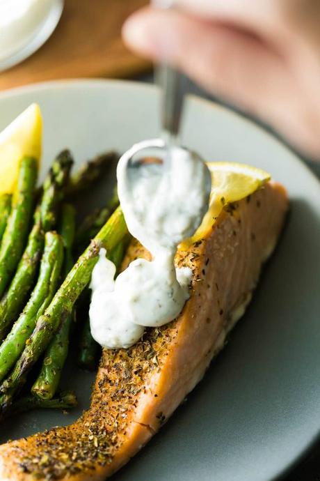 Lemon pepper sheet pan salmon with green beans, asparagus and lemon dill yogurt. You can prep this dish ahead and keep it in the fridge for up to 3 days before baking it.