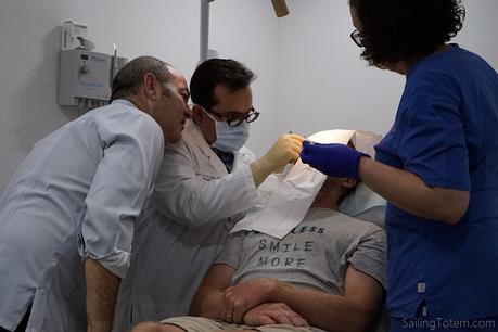 Facing up to health care Dr Santaliz sutures Jamie while Dr Villa looks on