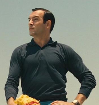 OSS 117’s Black Polo Shirt and Blue Trousers OSS 117’s Black Polo Shirt and Blue Trousers