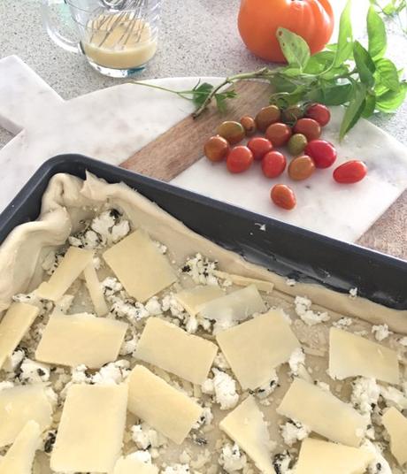Adding Cheese To Puff Pastry For Tomato Tart