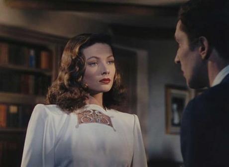 Gene Tierney in a white evening trouser suit suit with monogram-detail Gene Tierney in a white evening trouser suit suit with monogram-detail