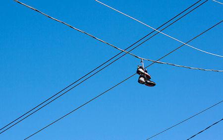 Shoefiti: The Myths And Mysteries Of Shoes On Power Lines