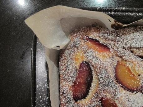 Plum slice topped with icing sugar