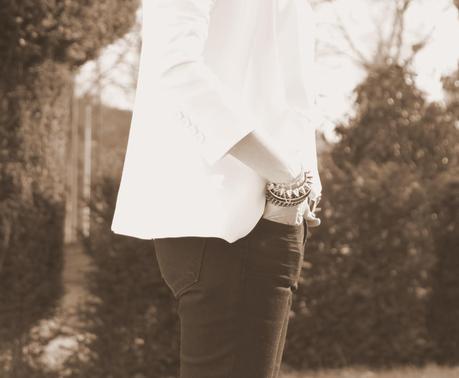 The white blazer and gold bracelets The white blazer and gold bracelets