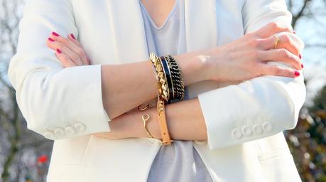 The white blazer and gold bracelets The white blazer and gold bracelets