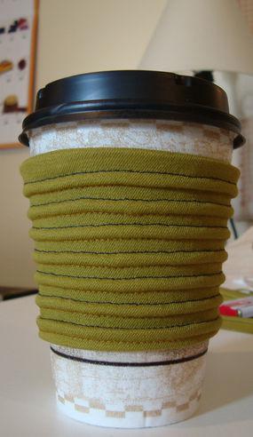 Reusable coffee sleeve with pintucking