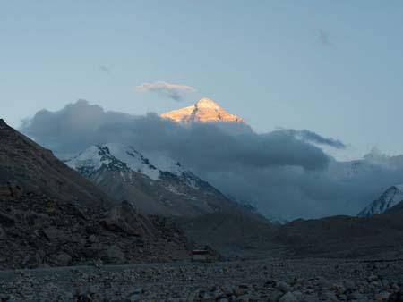Mount Everest seen at sunset when its highlighted golden