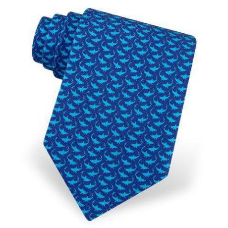 Turquoise sharks on a navy blue backgroud makes this tie a classic