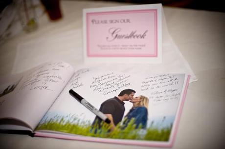 Want a guest book you'll actually look at again? Create a photo book of your engagement photos for guests to sign.