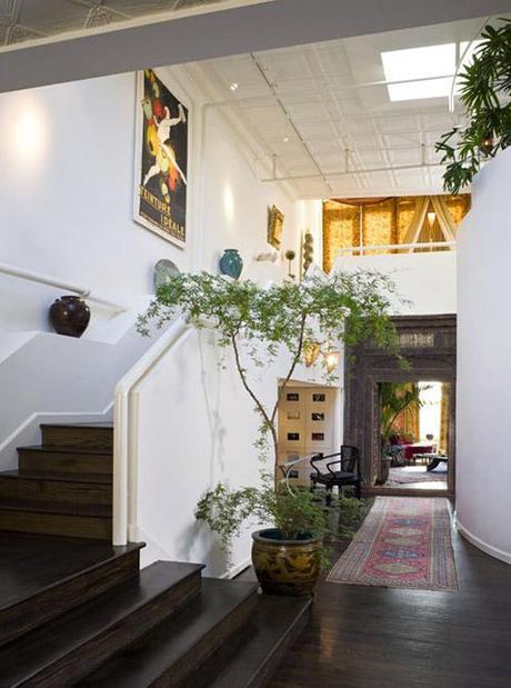 entry, turkish rug, large plant, Chelsea loft, via Curbed NY HOUSE PLANTS // Cheap Trick
