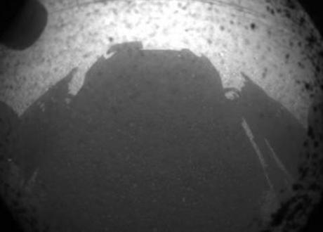 Mars rover Curiosity takes a picture of its own shadow, transmits back to earth.