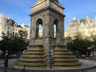 An intricate fountain in the Marais area of Paris