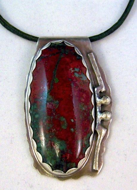 Chrysocolla is a copper-bearing gem that is often found m...