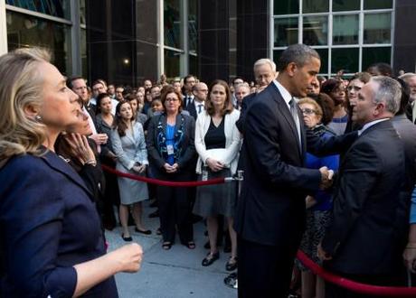 Obama and Clinton greet State Department employees after the death of Christopher Stevens in Libya.