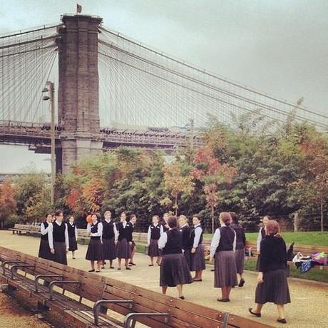 Only in New York. (A group of orthodox Jewish schoolgirls playing dodgeball against the backdrop of two bridges.) (at Brooklyn Bridge Promenade)