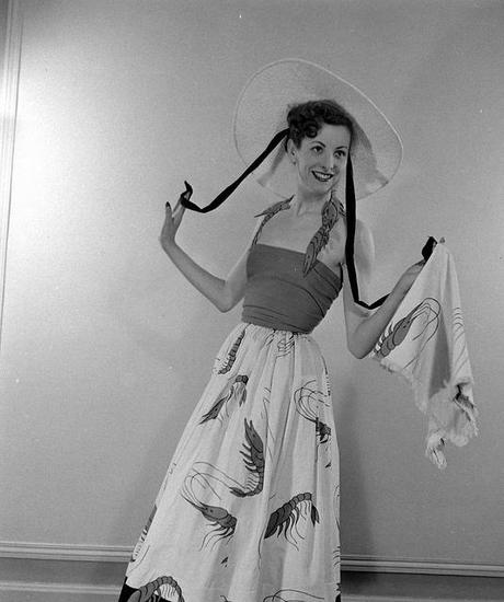 some resemblance to the Lobster dress by Elsa Schiaparelli? 
http://fbcljcreations.tumblr.com/post/23414890309/elsaschiaparellitheskinny

March 1948 - Photo by Mark Kauffman
