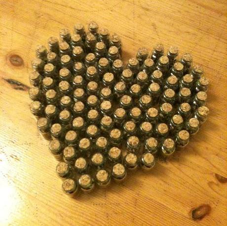 Heart-shaped array of wildflower seed vials (submitted by Caitlin M – bluedotjewelry.wordpress.com) 