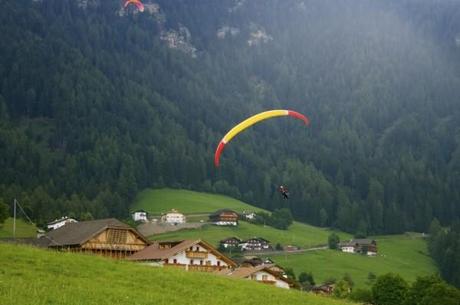 Preparing for the landing while paragliding in Alpe di Siusi (Seiser Alm)