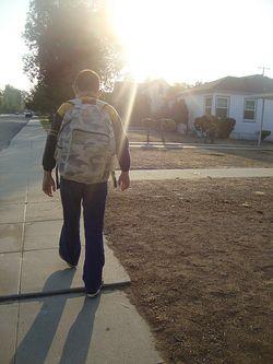 Samuel walking to school