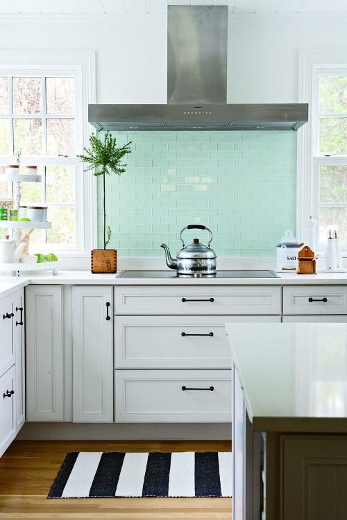 Color Roundup: Using Sky Blue in Interior Design sky blue backsplash tiles in a kitchen