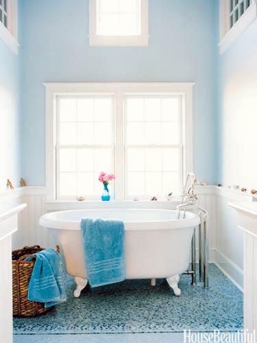 Color Roundup: Using Sky Blue in Interior Design Blue bathroom with Farrow and Ball's Borrowed light; mosaic tiles floor, cast iron bathtub