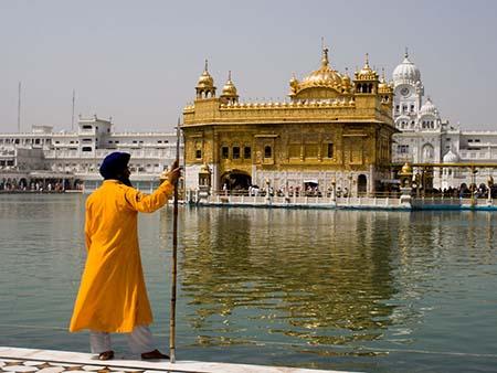 Sikh man in traditional dress and turban at the Golden Temple