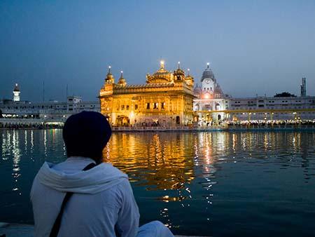 Sikh pilgrim viewing the Golden Temple