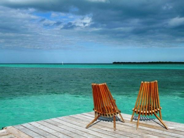 Beach chairs, beach scene, blue water