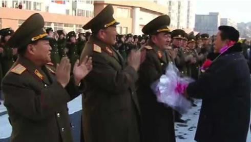 Minister of the People's Armed Forces, Gen. Kim Kyok Sik (3rd L) shakes hands with a Korean Committee for Space Technology manager on 4 January 2013.  Also seen in attendance are Gen. Choe Ryong Hae (L) and Gen. Hyon Yong Chol (2nd L) (Photo: KCTV screengrab)