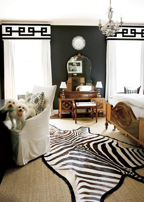 Color Roundup: Using Black in Interior Design a contemporary bedroom using black on the walls and white graphic draperies