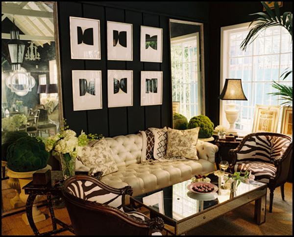 Color Roundup: Using Black in Interior Design black walls and cream sofa in a beautiful living room