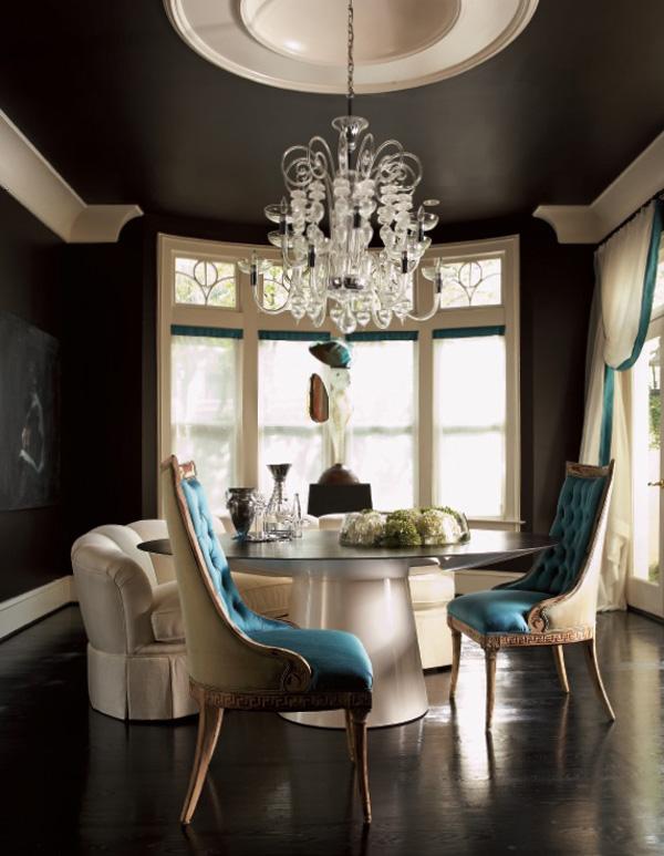 Color Roundup: Using Black in Interior Design black dining room with large white moldings and blue accents