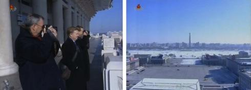 Google Executive Chairman Eric Schmidt (L) takes a photograph of the Chuch'e Tower (R) from the balcony of the Grand People's Study House in Pyongyang (Photos: KCTV screengrabs)