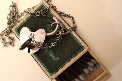 evolution now padlock and revolver necklaces