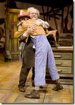 Geppetto (Don Forston) and his new son, Pinocchio (Skyler Adams), embrace for the first time in Chicago Shakespeare Theater’s world premiere musical Review: Adventures of Pinocchio (Chicago Shakespeare)