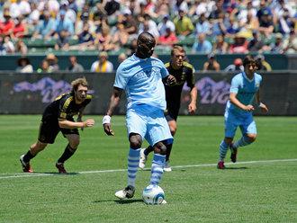 Two USMNT Players on the move, Mario being Mario http://images.sportinglife.com/11/07/330/mario-balotelli-manchester-city-2011_2626215.jpg