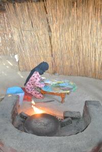 A Bedouin woman making flat bread